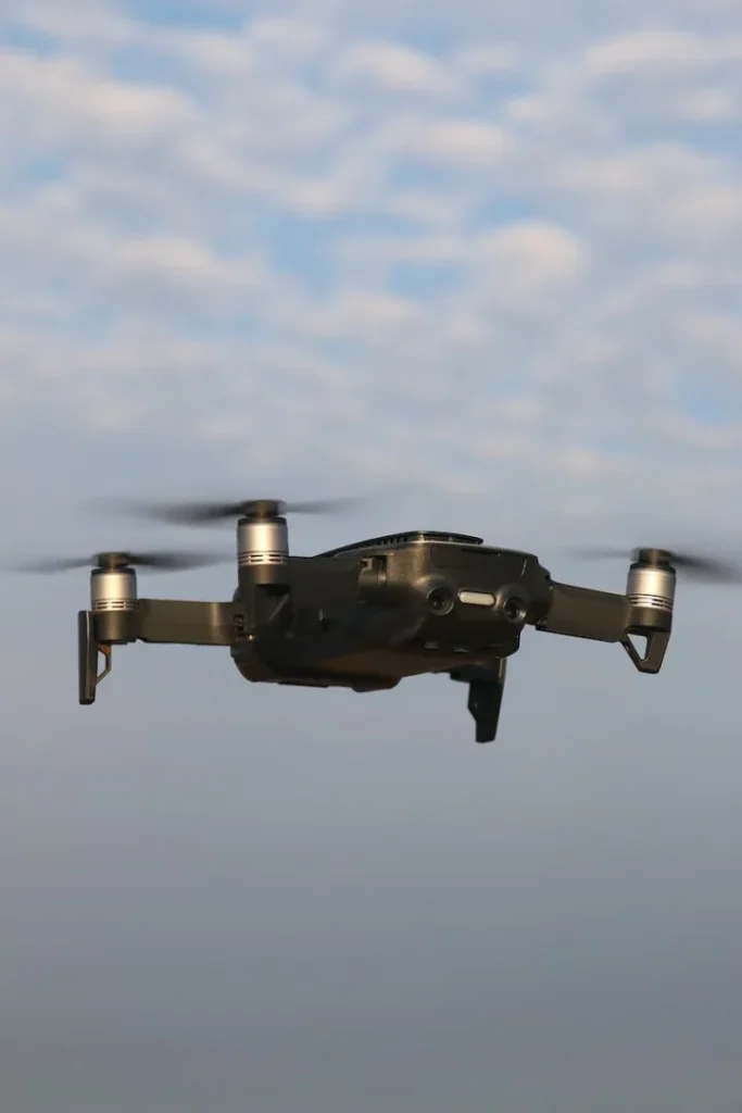 black and gray drone in mid air