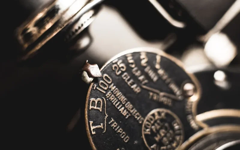 a close up of a typewriter with a clock on it